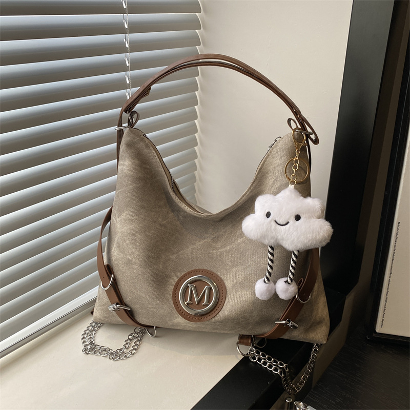 A new large-capacity casual commuting bag for women in the autumn and winter of 2024, featuring a contrasting color backpack and a single-shoulder crossbody tote bag full figure