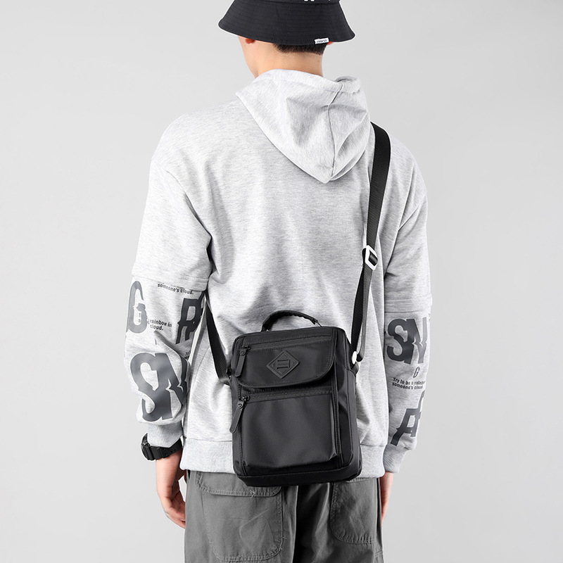 A new large-capacity casual shoulder bag for men, made of nylon fabric, and a small square hand-held bag for men details Picture