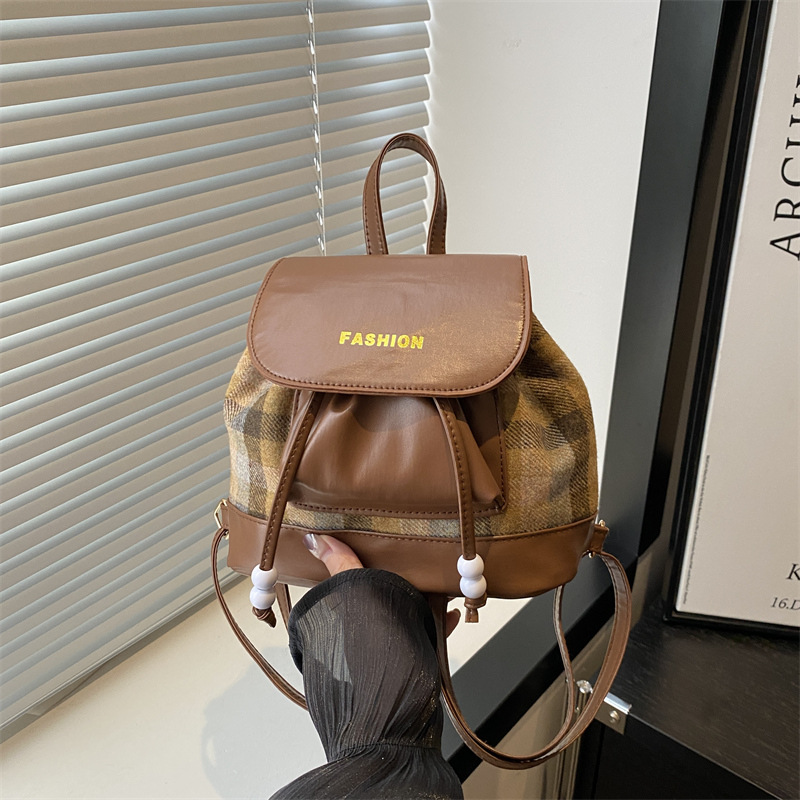 The 2024 new stylish and versatile large-capacity backpack features a simple and casual Korean-style checkered color-blocking spliced Instagram crossbody bag full figure