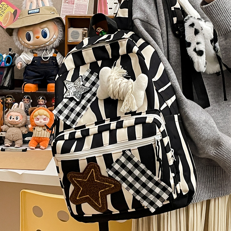 New autumn and winter unisex backpacks featuring star-shaped plush, cute bones, versatile and large-capacity zebra-patterned backpacks Application Scenario