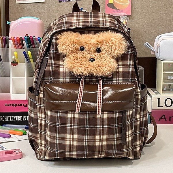The new cute puppy backpack features a large capacity with a fashionable checkered pattern, a school-style and adorable backpack for young girls, and a student schoolbag full figure