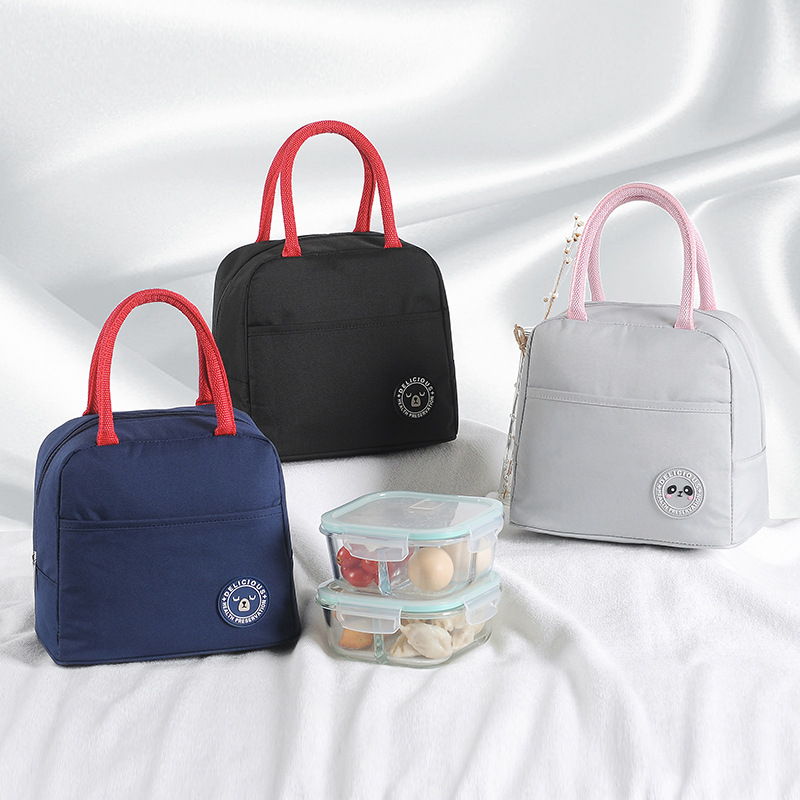 Wholesale of cute pet cartoon insulated lunch boxes, hand-held bags, student lunch boxes, Oxford cloth picnic bags, and rice bags full figure