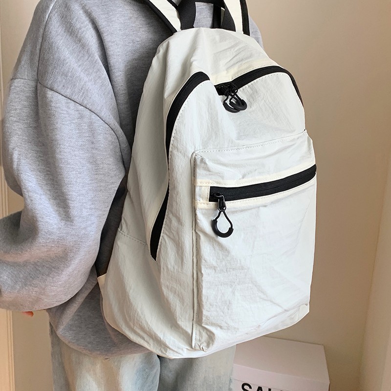 This is a large-capacity, solid-color, waterproof, lightweight and versatile new autumn and winter casual backpack for students Application Scenario