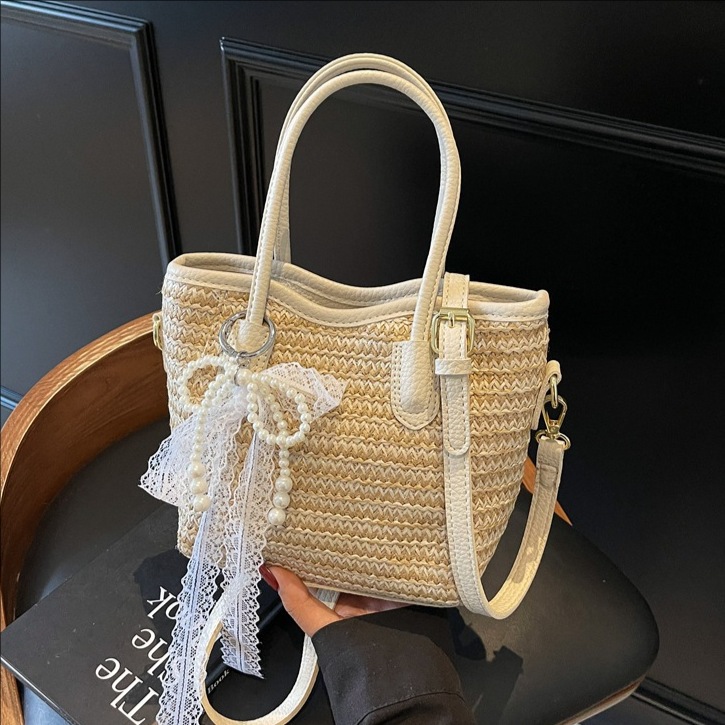 Trendy large-capacity straw-woven hand-held bucket bag for women 2025 New style beach vacation commuting fashion single-shoulder crossbody bag full figure