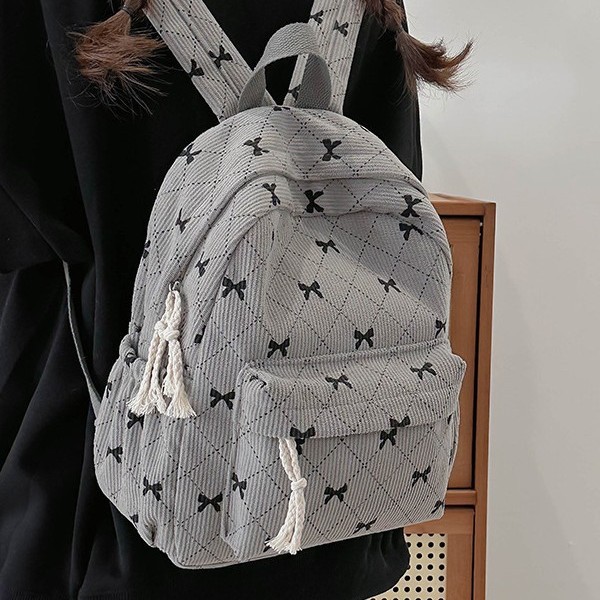 Autumn and winter corduroy schoolbags for girls, simple and versatile backpacks, bow-shaped small bags, lightweight travel backpacks full figure