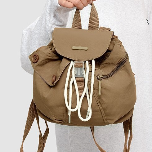 2024 New Korean ins women's niche design lightweight pocket button drawstring backpack with multiple pockets Application Scenario
