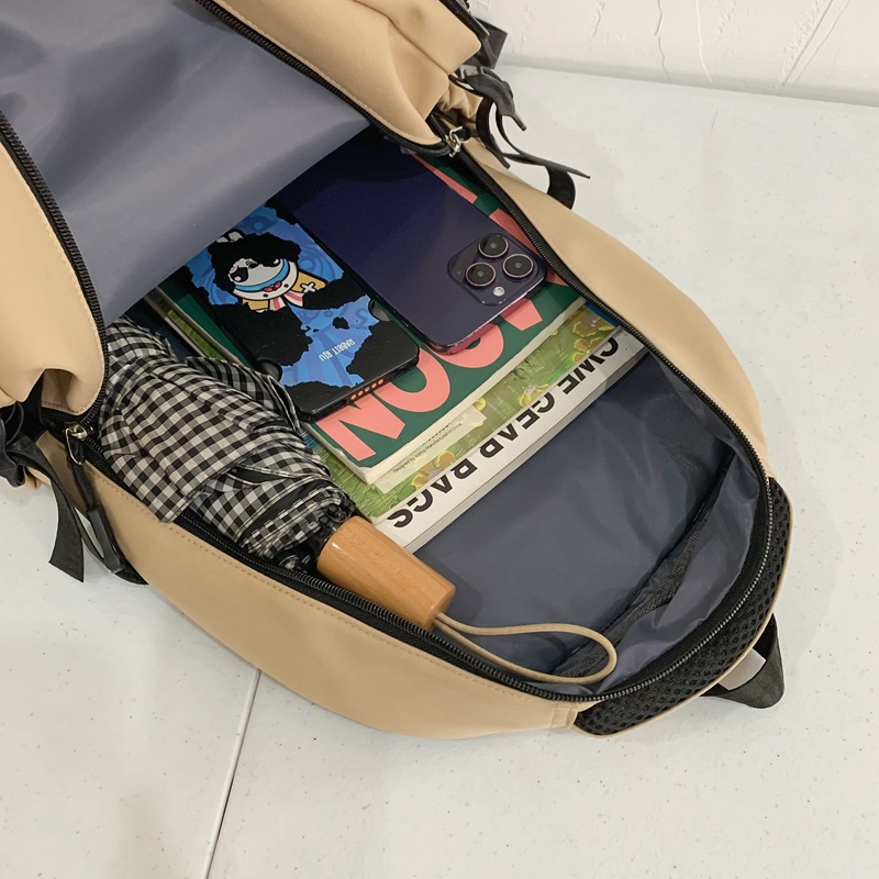 2024 Bestseller Durable multi-functional large-capacity solid-color schoolbag for boys and girls, primary and junior high school students, multi-layer trendy bag Application Scenario