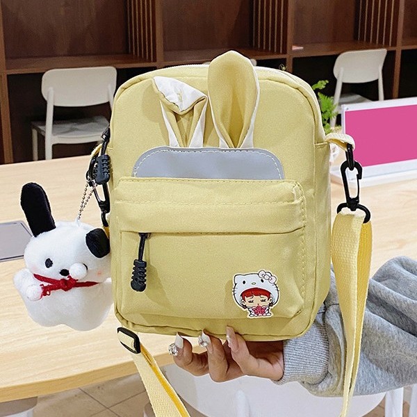 A new Korean-style cute rabbit-ear backpack for primary school students, suitable for both men and women, and a Japanese-style cute crossbody bag for young girls details Picture