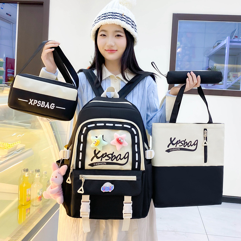 A fresh, sweet and cute four-piece backpack for girls, a schoolbag for primary school students, a Japanese-style versatile canvas backpack with large capacity Application Scenario