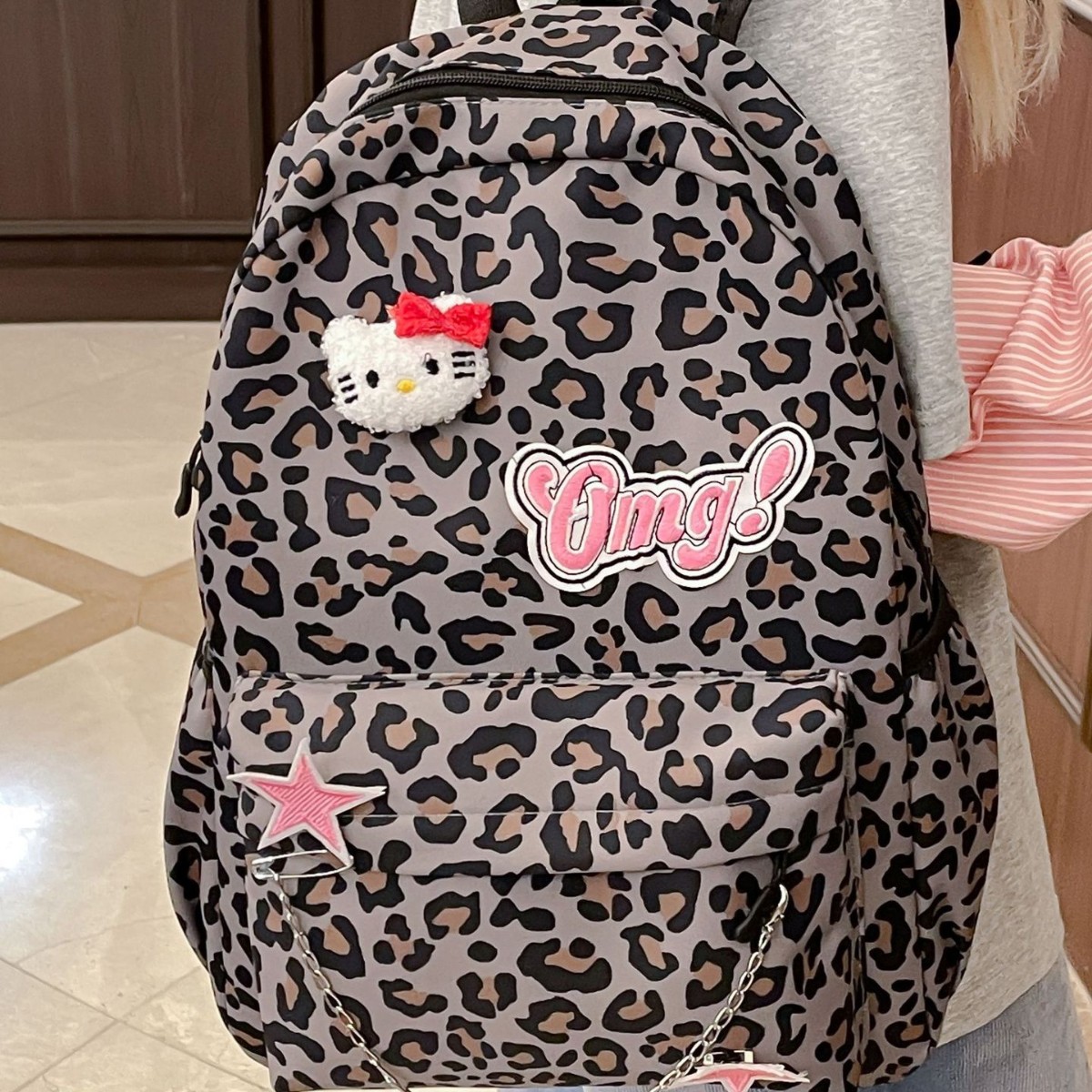 The new cartoon girl leopard print backpack is cute and has a large capacity. It is a versatile and fashionable backpack for students details Picture