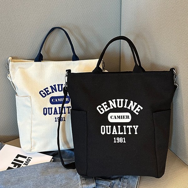 Canvas backpack bag, cotton letter casual hand-held bag, printed cosmetics and accessories, new cotton canvas bag full figure