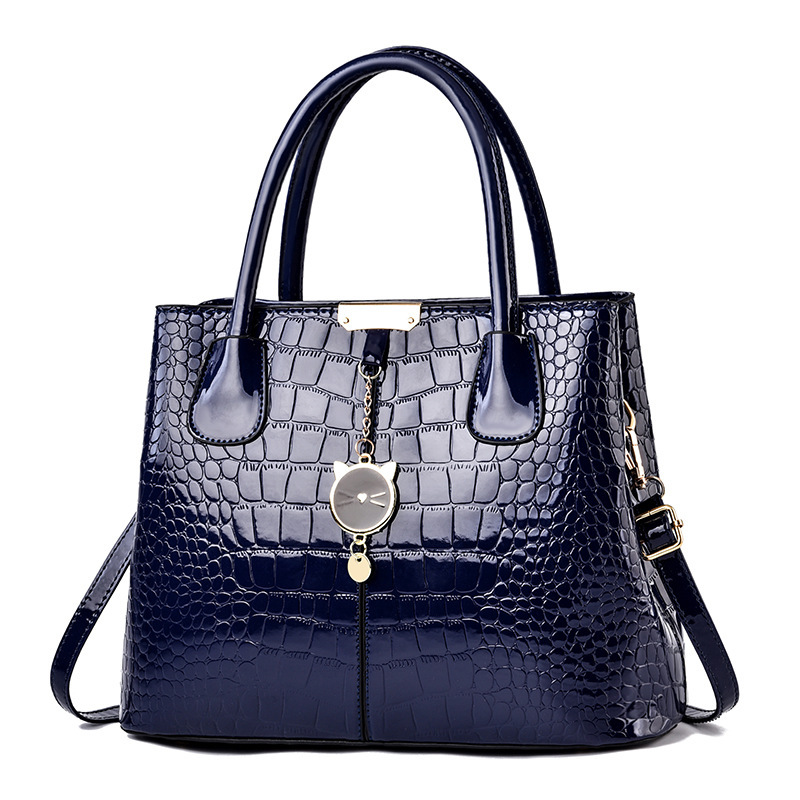 The 2021 new shiny leather women's bag with a European and American style, featuring a simple stone pattern, is a large hand-held shoulder crossbody bag Specification drawing