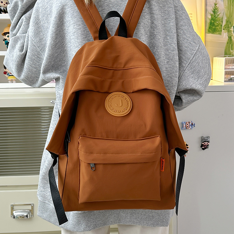 2025 New outdoor schoolbag, backpack, versatile, college student backpack, lightweight computer, large-capacity travel bag full figure