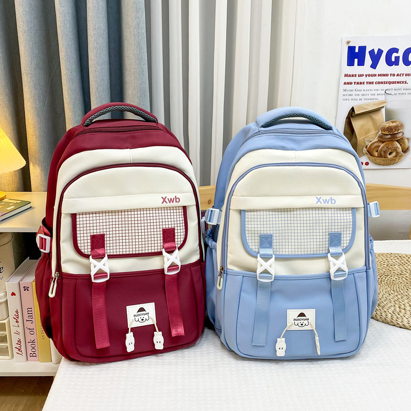 Wholesale 2025 new style primary and junior high school boys' backpacks for reducing burden and protecting the spine, and high school girls' large-capacity travel backpacks full figure