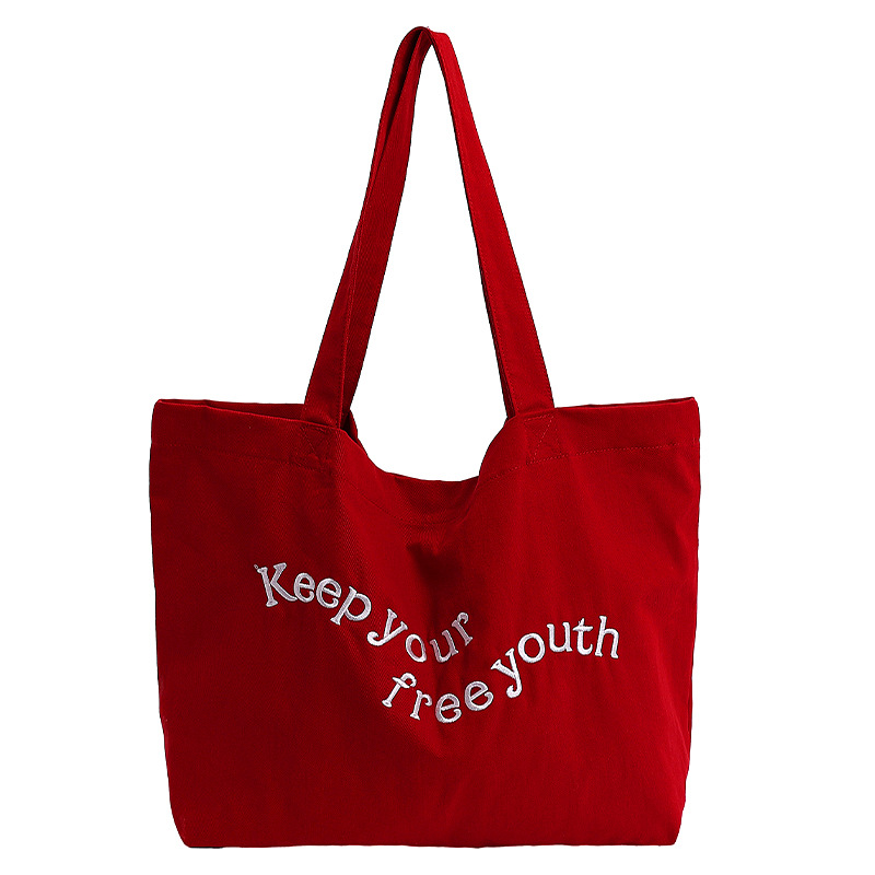 The 2025 new red letter-style fashionable canvas tote bag is a versatile high-capacity single-shoulder bag for commuting Item Picture