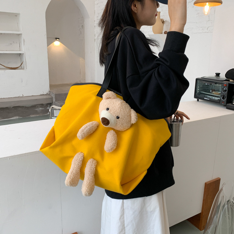 2025 New student after-school canvas bag, a simple and stylish backpack for a pretty girl on the street, an artistic and fashionable bear doll single-shoulder bag Application Scenario