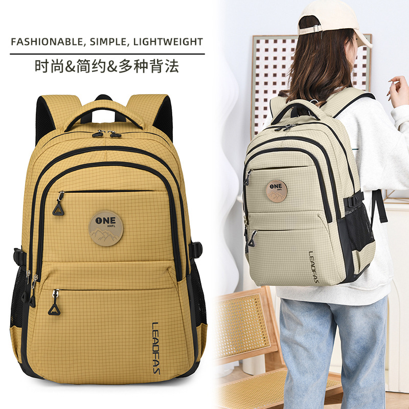 Cross-border 2025 New Schoolbag with large capacity, spine protection and burden reduction. It is a backpack for junior high school, senior high school and college students, as well as a leisure travel backpack full figure
