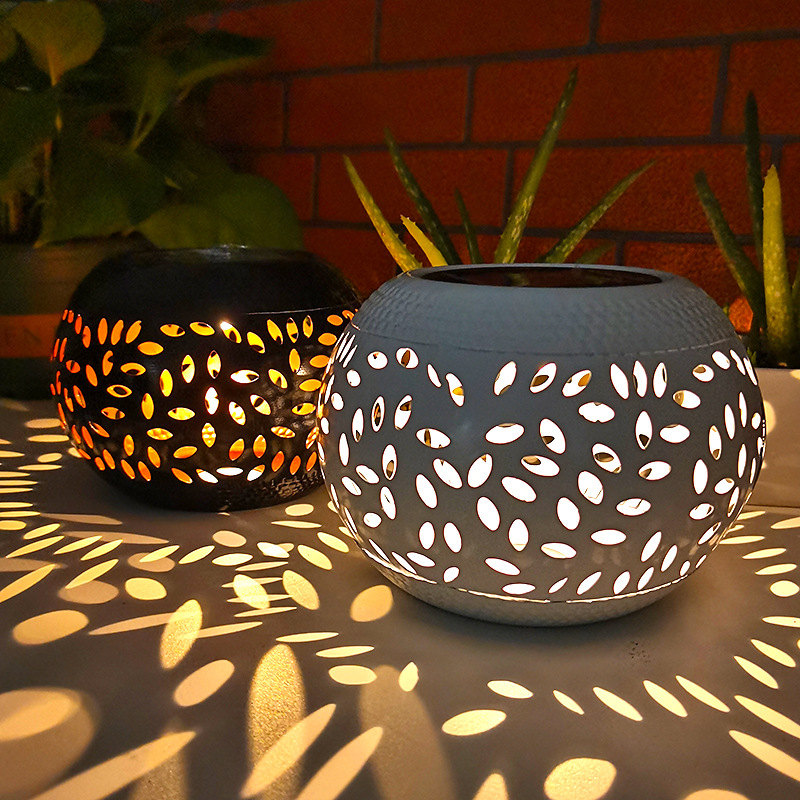 Factory-direct heating sales cross-border outdoor ironwork solar lamps, ceramic-like hollowed-out lawn lamps, and courtyard landscape lanterns full figure