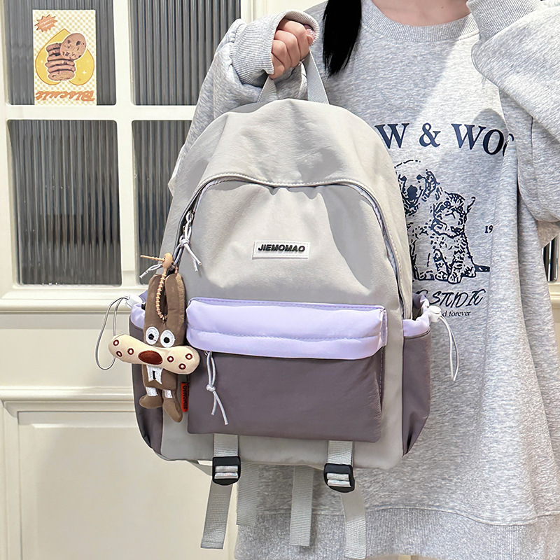 The new 2025 minimalist backpack for junior high school students with contrasting colors is a lightweight outdoor schoolbag that goes well with college students for hiking Specification drawing