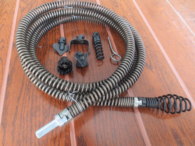 A household sewer unclogging tool, a hand drill, 12mm spring for unclogging pipes undefined