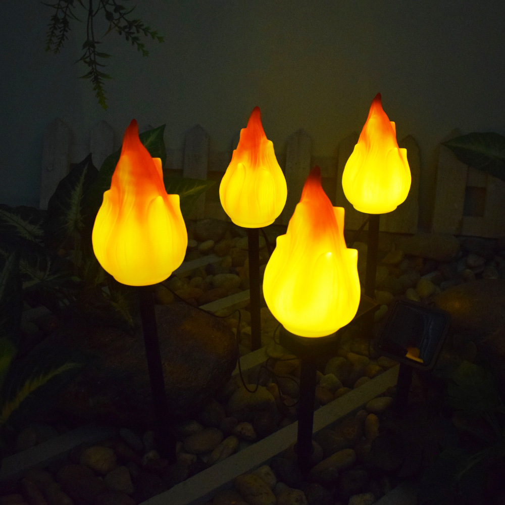 New solar-powered outdoor garden lamp, plastic flame ground plug, atmosphere range camping lamp, decorative landscape Application Scenario