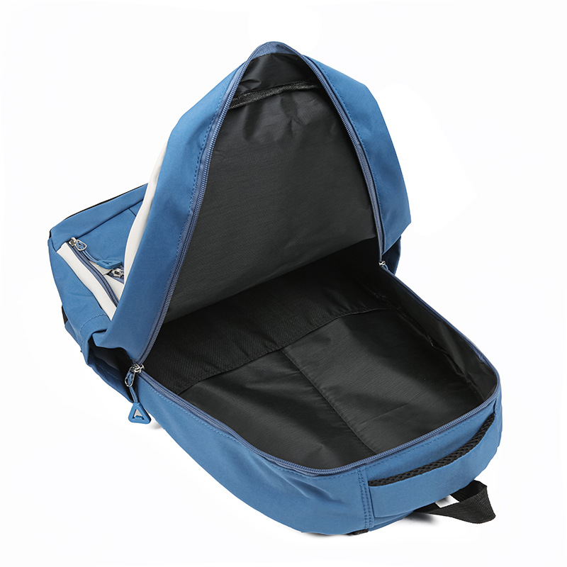 A new Korean-style trendy backpack with a large capacity and a simple color contrast for junior high school students' travel Application Scenario