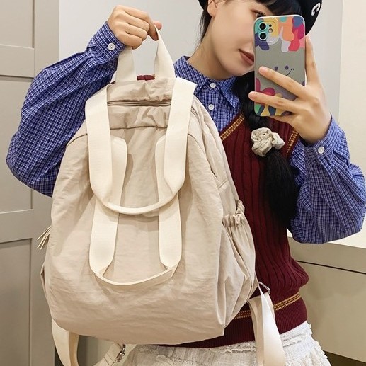 Japanese fashion trend large-capacity schoolbag, casual sports backpack, backpack for junior and senior high school students, solid-color backpack Application Scenario