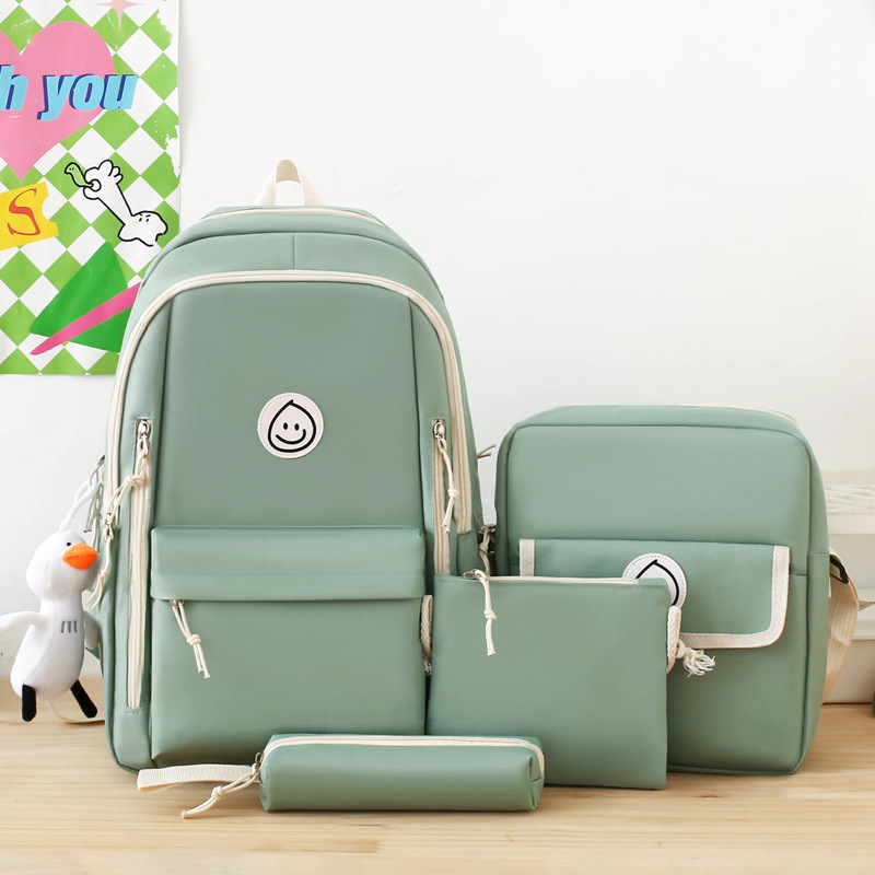 A new four-piece set of schoolbag for foreign trade, a simple and solid Korean-style forest-themed backpack with a large capacity and a fresh look for women Application Scenario