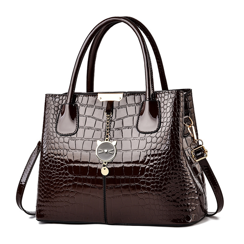 The 2021 new shiny leather women's bag with a European and American style, featuring a simple stone pattern, is a large hand-held shoulder crossbody bag Item Picture