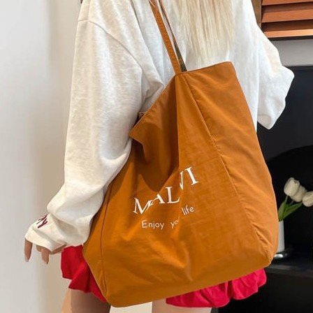 Summer's new trendy fabric backpack, camouflage dazzling, large-capacity, lightweight, simple and fashionable backpack details Picture