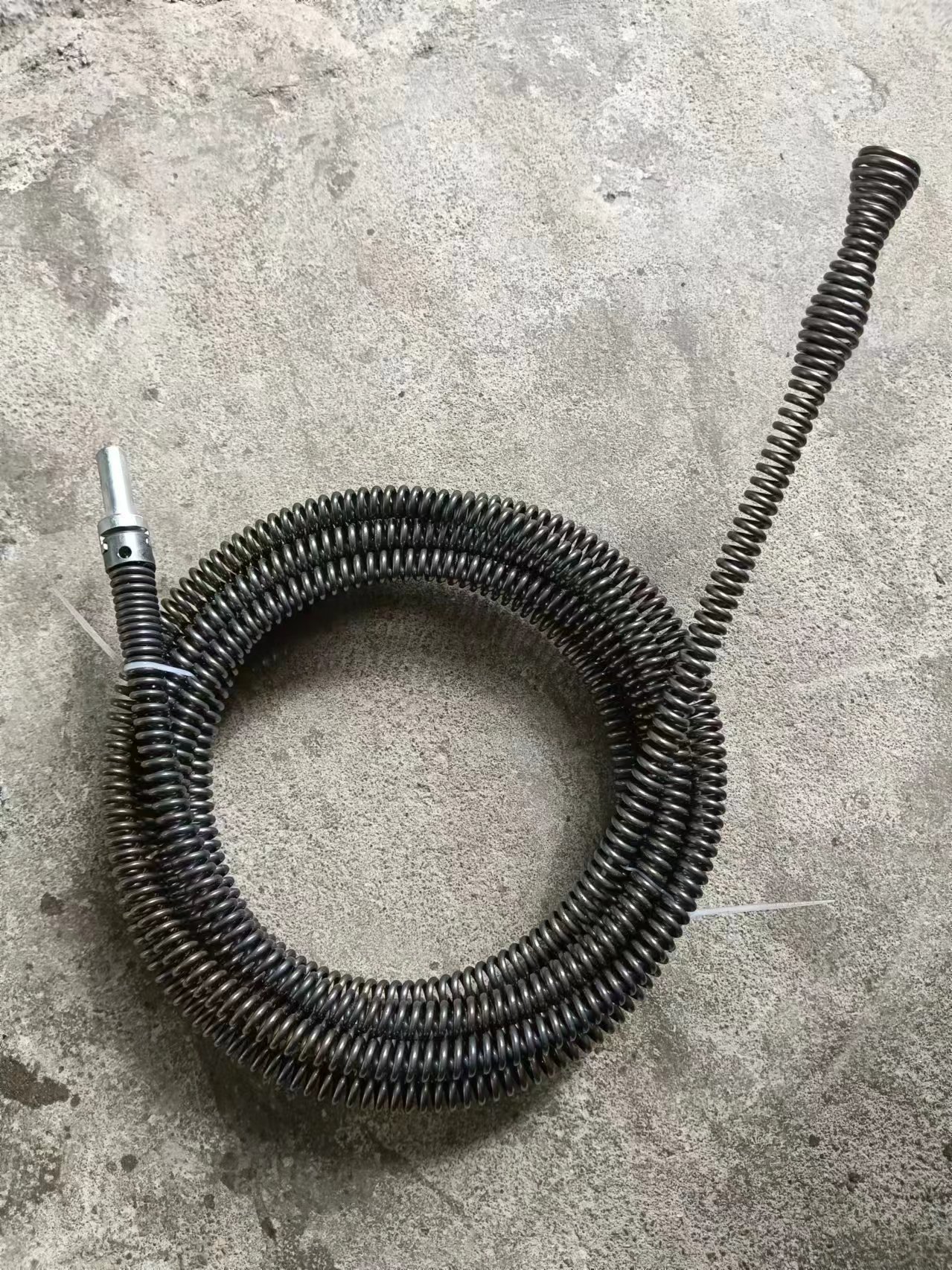 A household sewer unclogging tool, a hand drill, 12mm spring for unclogging pipes undefined