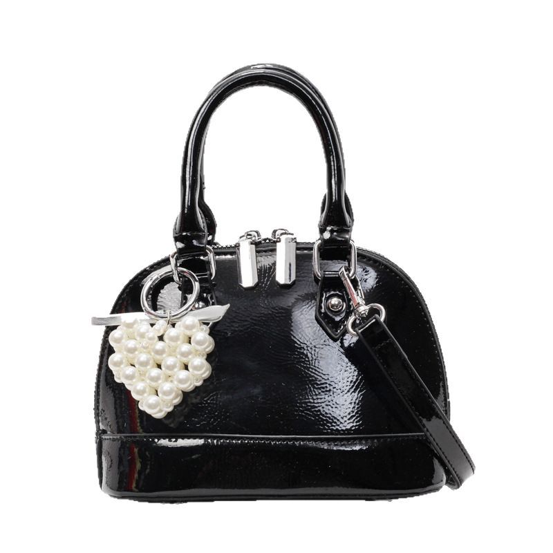 A fashionable solid color, simple and versatile hand-held shell bag for women, a new 2025 light luxury, niche and high-end single-shoulder crossbody bag Item Picture