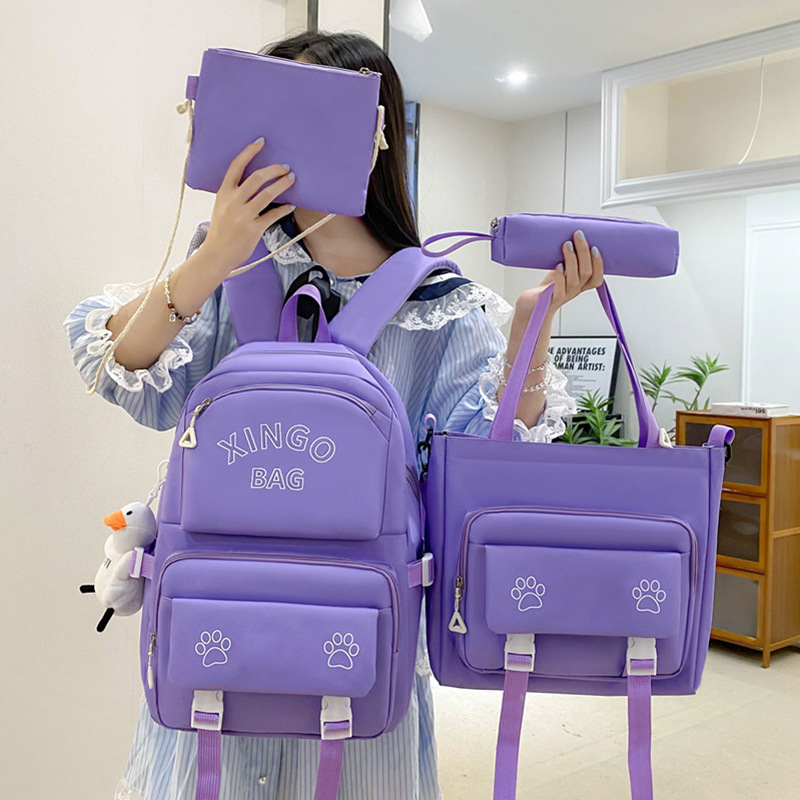 Four-piece Korean-style schoolbag for girls, solid-color printed schoolbag, simple and large-capacity backrest backpack for junior high school students full figure