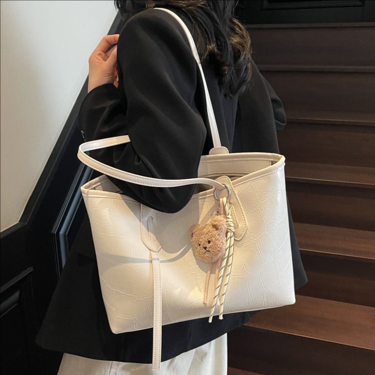 High-end stone-patterned large-capacity hand-held tote bag for women 2025 new style, fashionable and simple solid color commuting single-shoulder bag full figure