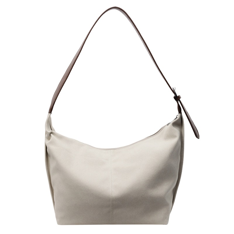 A new solid-color design bag for women, a popular solid-color single-shoulder crossbody bag, a casual large-capacity commuter tote bag Item Picture
