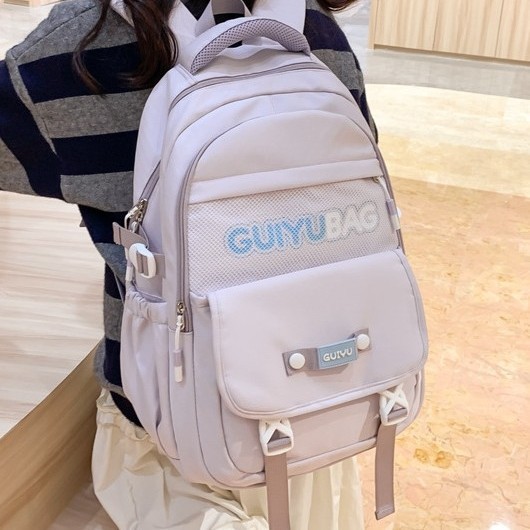 The new schoolbag is simple and versatile for female middle school students. It features a large-capacity, fashionable solid color backpack and a college-style backpack for high school students full figure