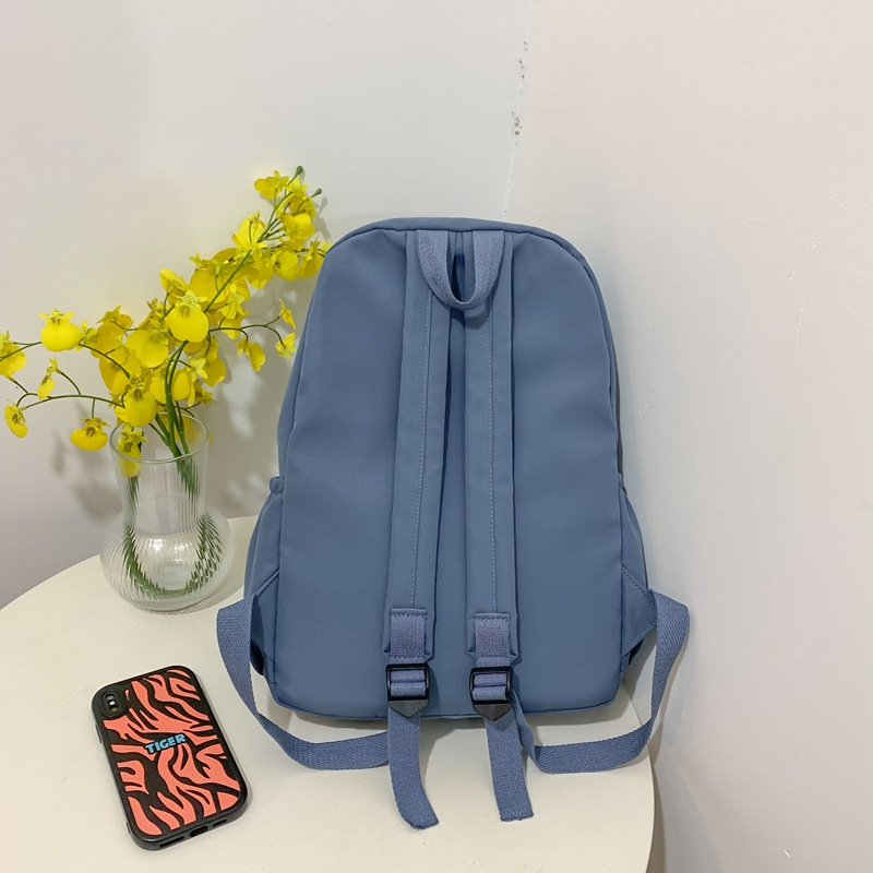 Wholesale of new solid-color backpacks, Korean version of ins schoolbags for junior high school, senior high school and college students, and large-capacity backpacks for leisure travel Application Scenario