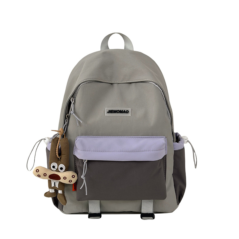 The new 2025 minimalist backpack for junior high school students with contrasting colors is a lightweight outdoor schoolbag that goes well with college students for hiking Item Picture