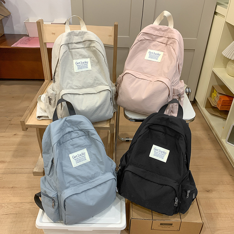 The 2025 new backpack for women's university birthday is a lightweight, casual, simple, waterproof and large-capacity travel backpack Specification drawing