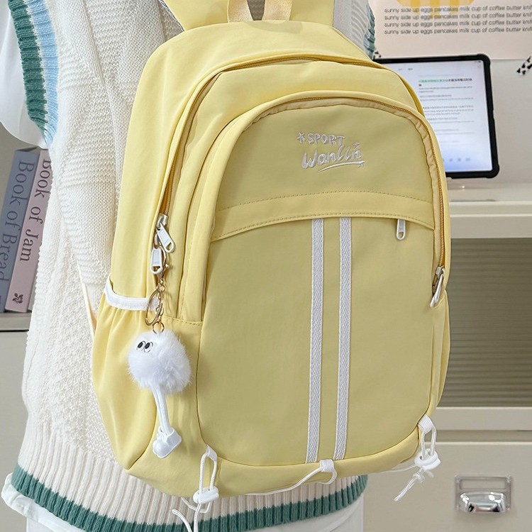 This fashionable and cute girlish backpack has a strong design sense. It is a large-capacity student backpack that reduces the burden. The color-blocking casual and versatile schoolbag full figure