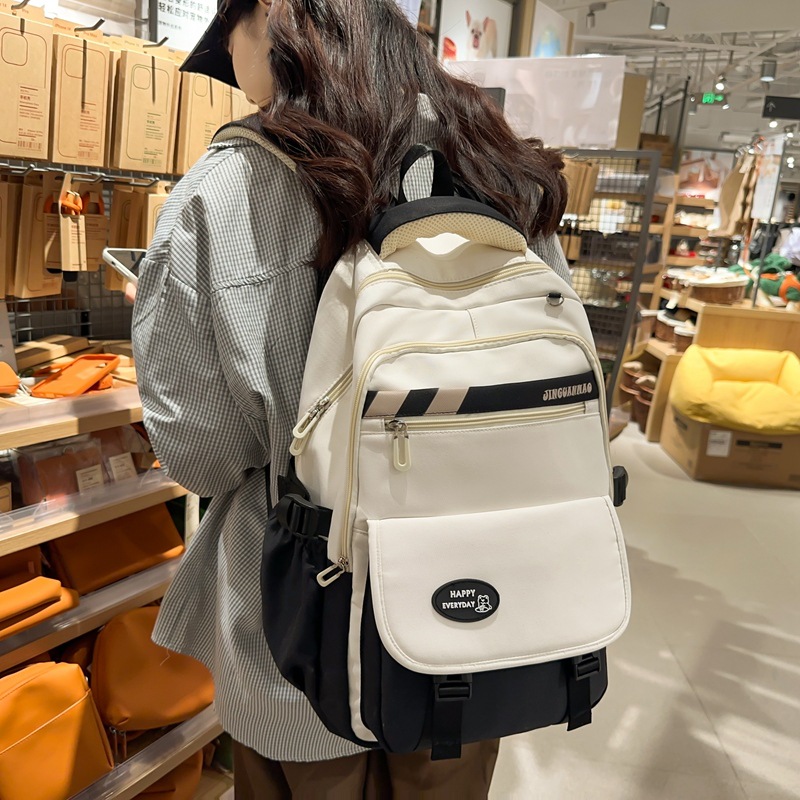 Manufacturer's in-stock large-capacity junior high school student schoolbags, girls' high school appearance level versatile casual backpacks, weight-reducing and spine-protecting backpacks full figure