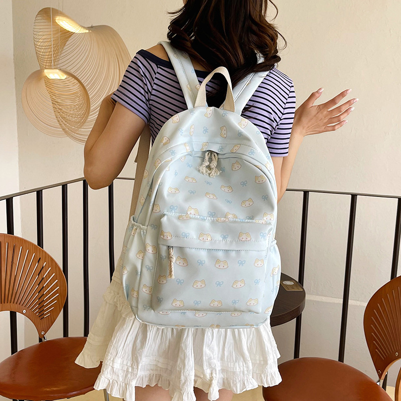 Cartoonish and cute ins fresh backpack, simple printed casual student schoolbag, large-capacity travel trendy backpack details Picture