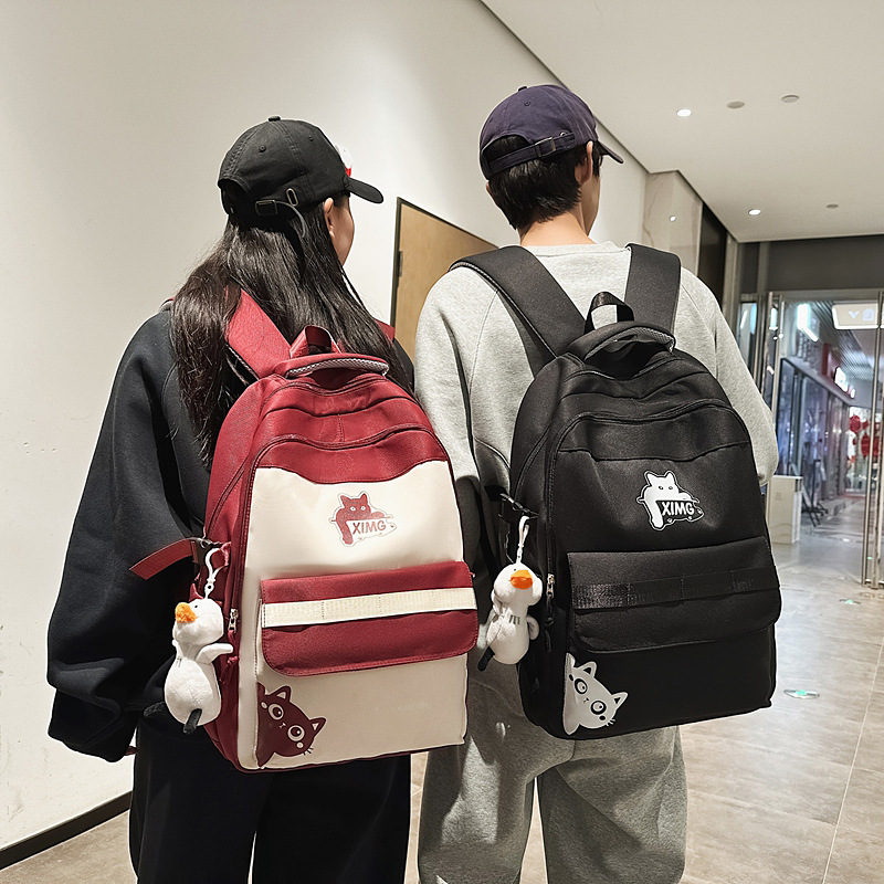 2025 color-blocking large-capacity student schoolbags, junior and senior high school backpacks, simple and Ins-style computer bags, and fashionable bags Application Scenario