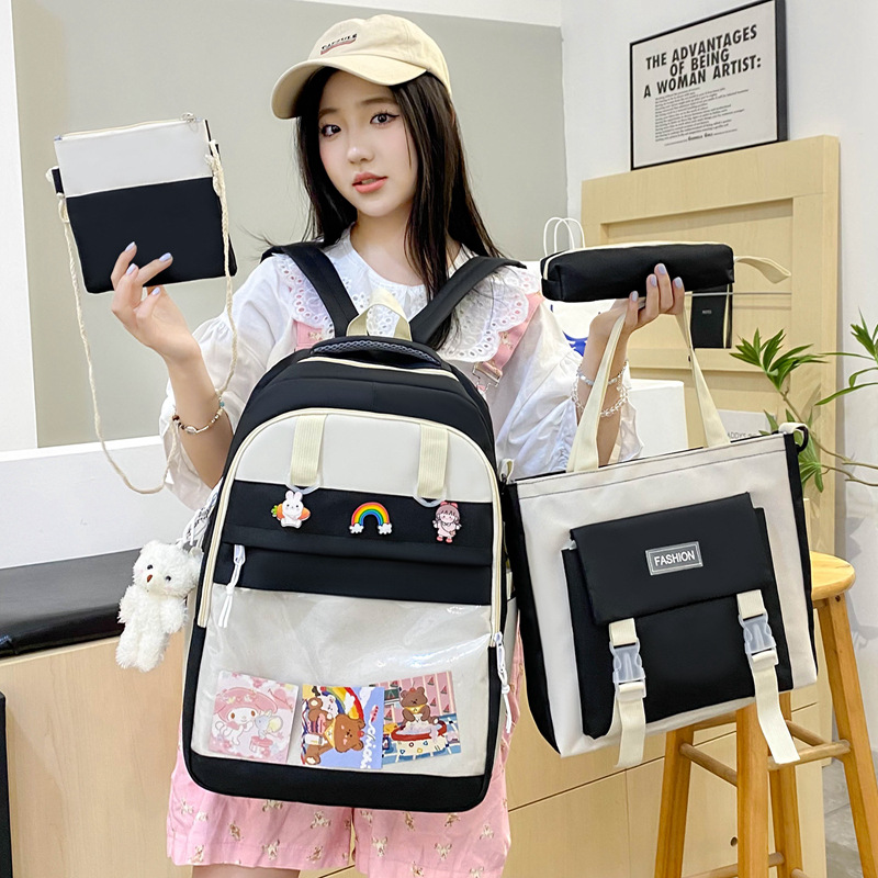 A new large-capacity four-piece schoolbag for girls, a lightweight back-protecting backpack with contrasting colors, and a storage backpack for middle school students full figure