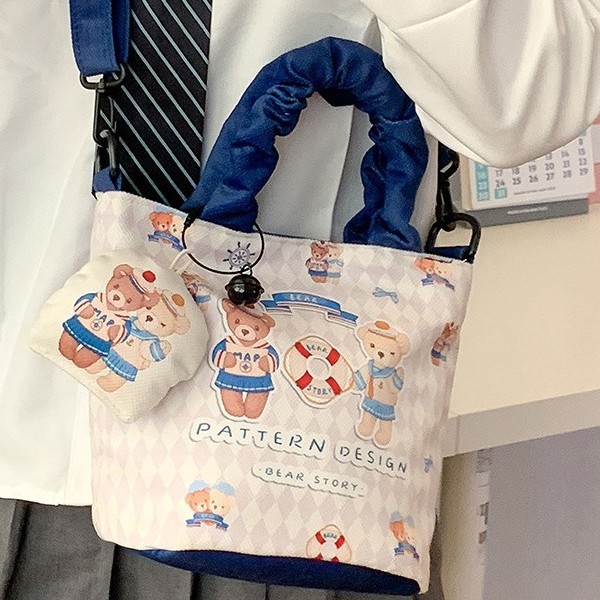 Canvas bag 2025 New cartoon-printed commuter small cloth bag, hand-held cloth bag, large-capacity casual bucket bag Application Scenario