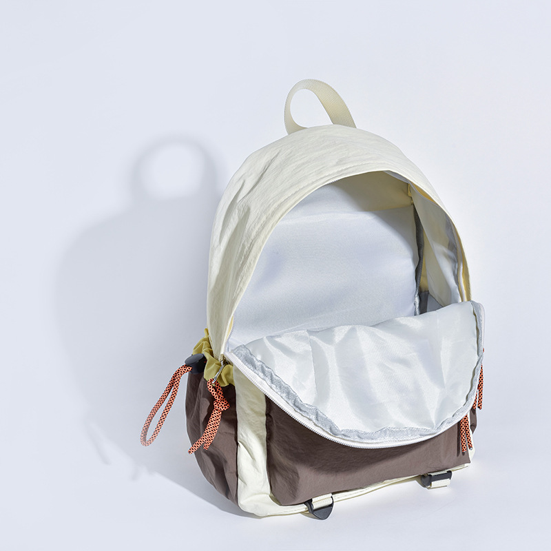 New lightweight outdoor travel backpack for college students, simple small schoolbag, Korean style color contrast, versatile and fresh backpack Application Scenario