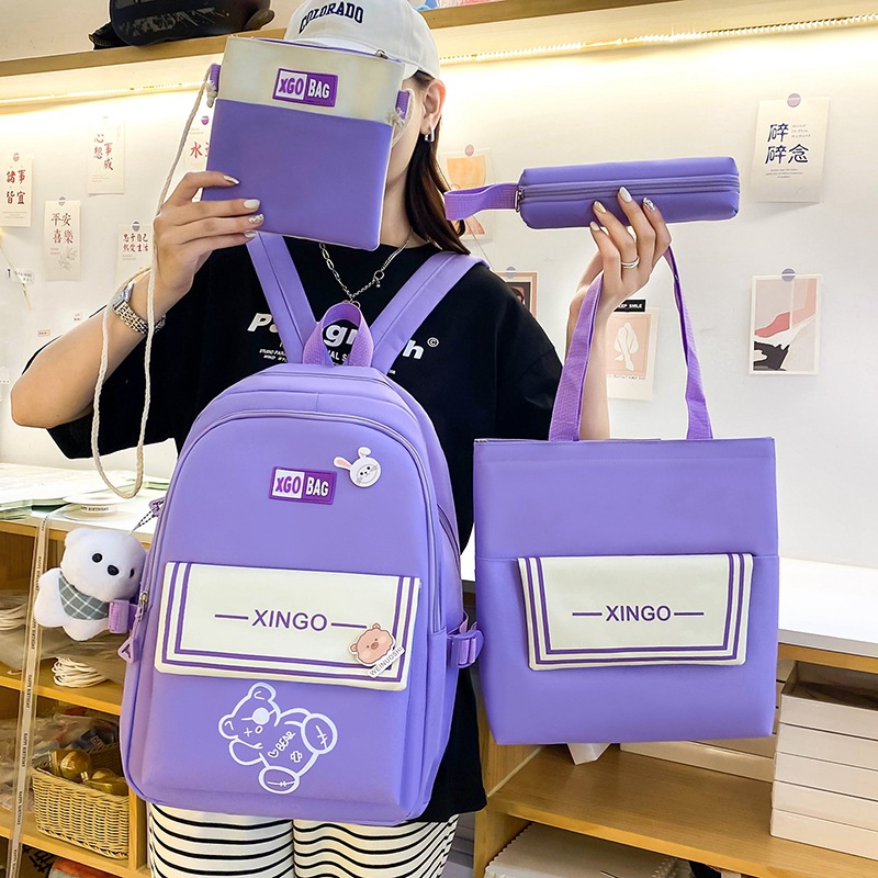 A four-piece set of lightweight and simple cartoon backpack for girls in grades three to six, a large-capacity Korean version backpack full figure