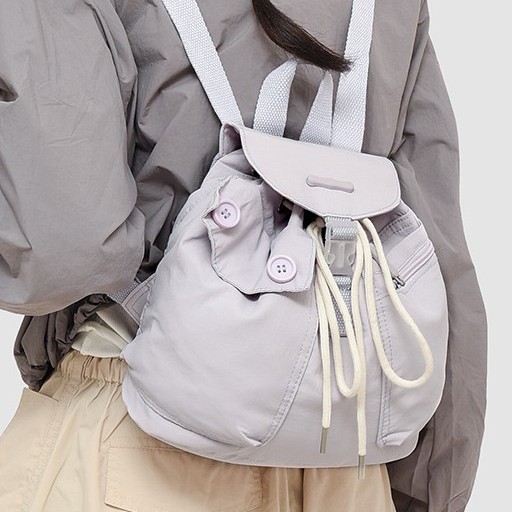 2024 New Korean ins women's niche design lightweight pocket button drawstring backpack with multiple pockets full figure