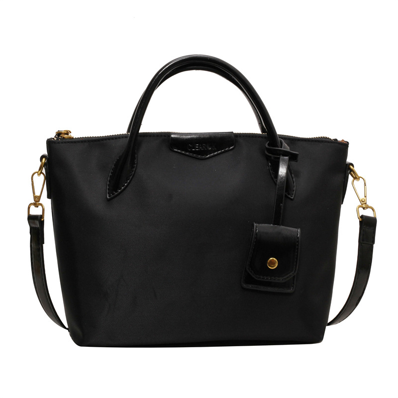 A versatile, fashionable and high-end Oxford fabric large-capacity tote bag for women, a new 2023 solid color commuter crossbody bag Item Picture