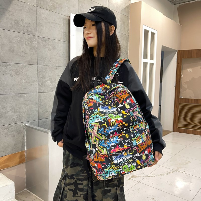 Trendy ins graffiti cartoon double-shoulder street large-capacity schoolbag, versatile computer bag, color-blocking travel backpack full figure